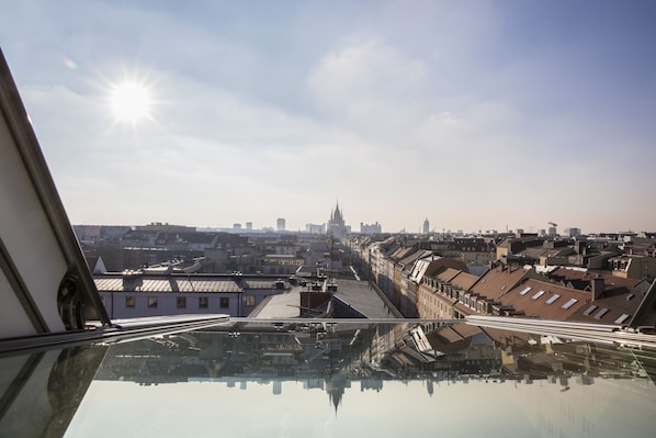 A cityscape viewed from a high vantage point, including a prominent building with a spire. - City Aparthotel Muenchen (Muenchen)