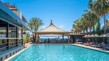 Indoor pool, pool umbrellas, pool loungers