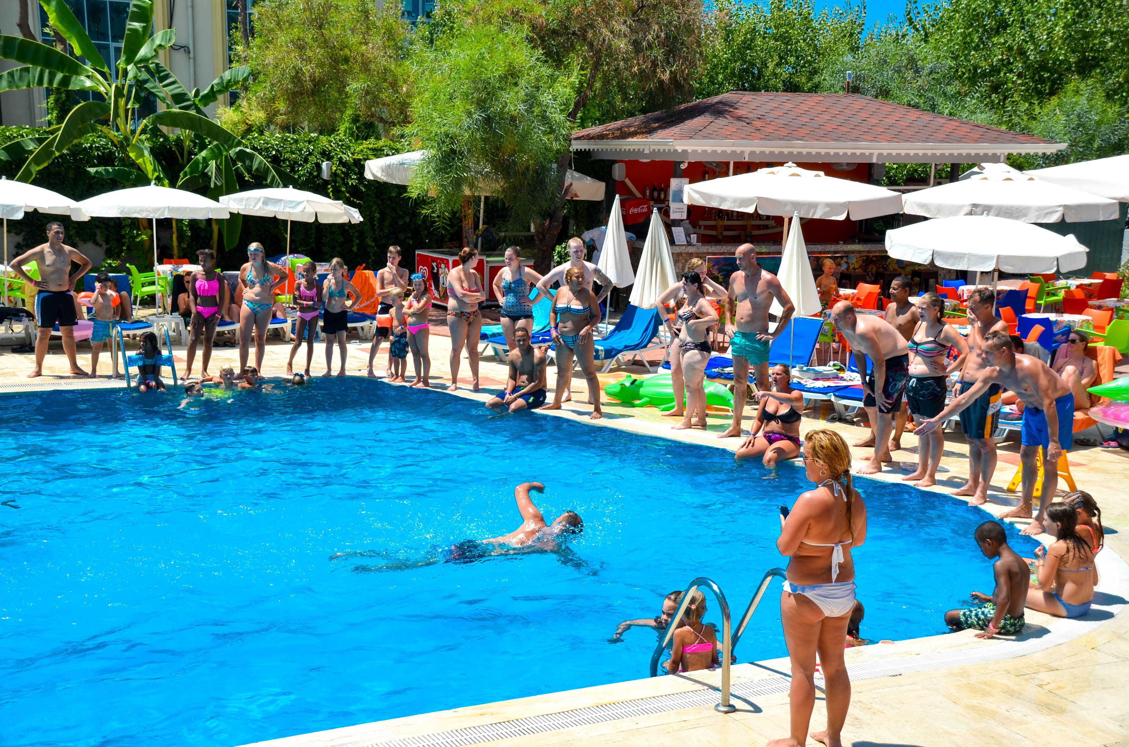 seasonal outdoor pool, open 8:00 am to 7:00 pm, pool umbrellas