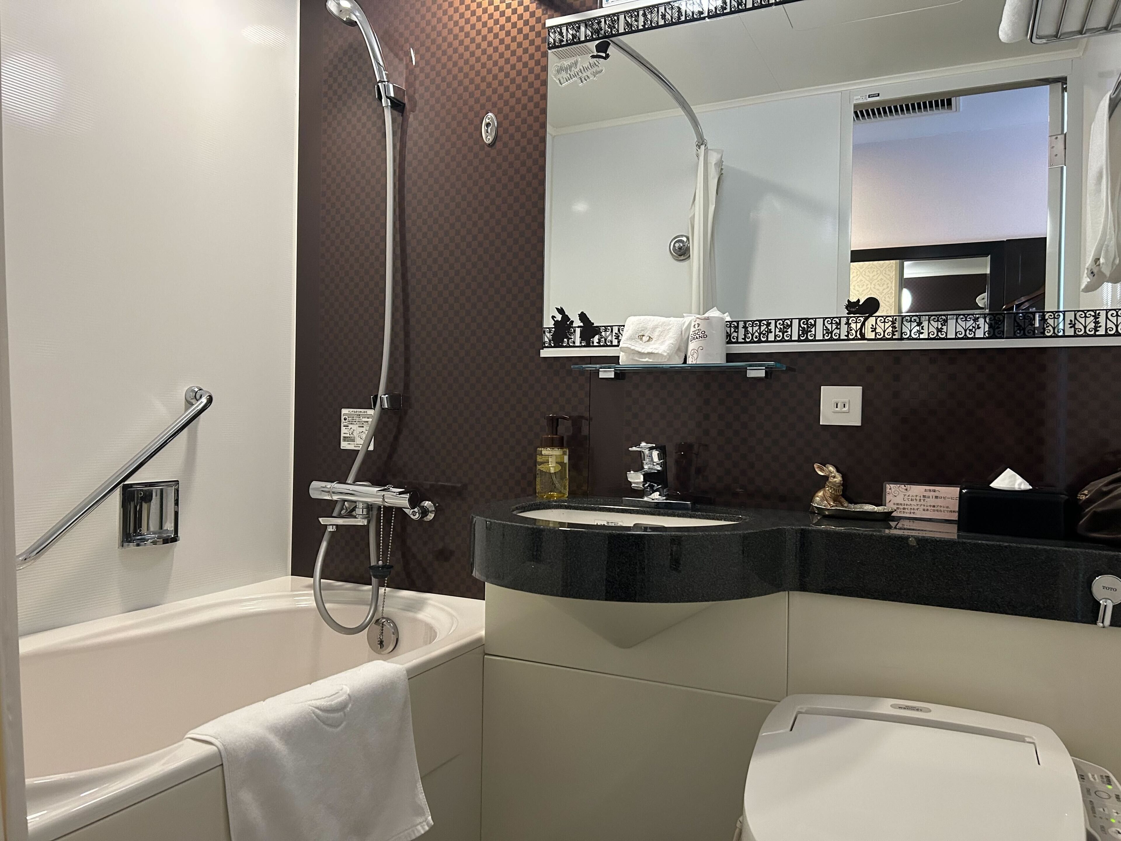 combined shower/bathtub, free toiletries, hair dryer, slippers