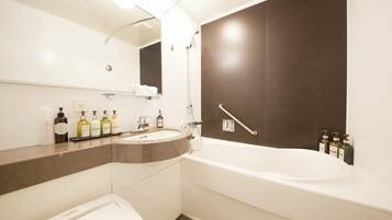 Combined shower/tub, free toiletries, hair dryer, slippers