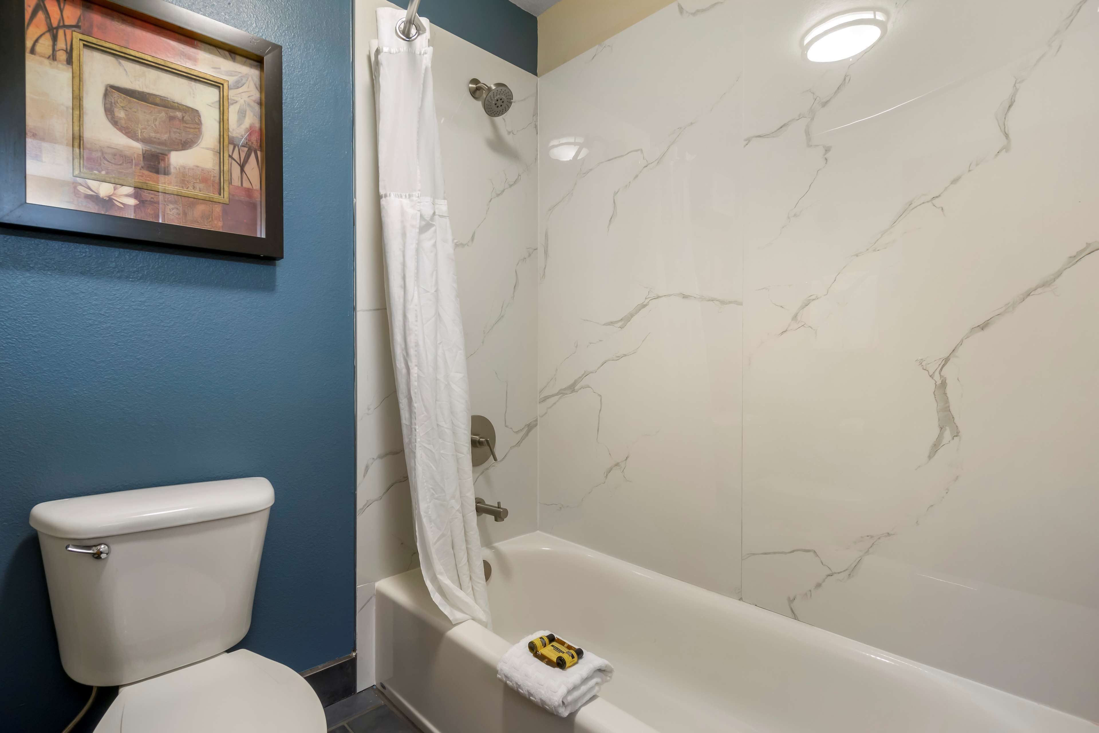 standard room, 2 queen beds, non smoking, refrigerator & microwave | bathroom | free toiletries, hair dryer, towels