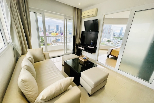 Apartment, 1 King Bed | Living area | 32-inch flat-screen TV with cable channels, TV
