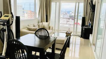 Apartment, 1 King Bed | Living area | 32-inch flat-screen TV with cable channels, TV
