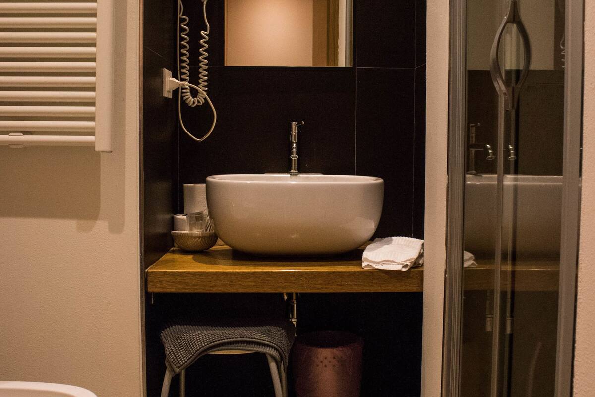 superior triple room | bathroom | shower, free toiletries, hair dryer, towels