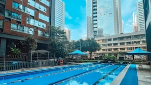 A swimming pool with clear blue water, surrounded by modern buildings and a clear sky. - Lavande International ApartHotel US Consulate General Guangzhou Zhujiang New Town Metro Branch - Free Shuttle Bus to Canton Fair Complex During Canton Fair Period & Free VPN Internet Access (Guangzhou)