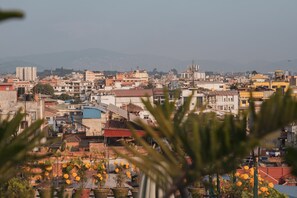 A cityscape with buildings, some with visible balconies and rooftops. - Hotel Nepalaya (Kathmandu)