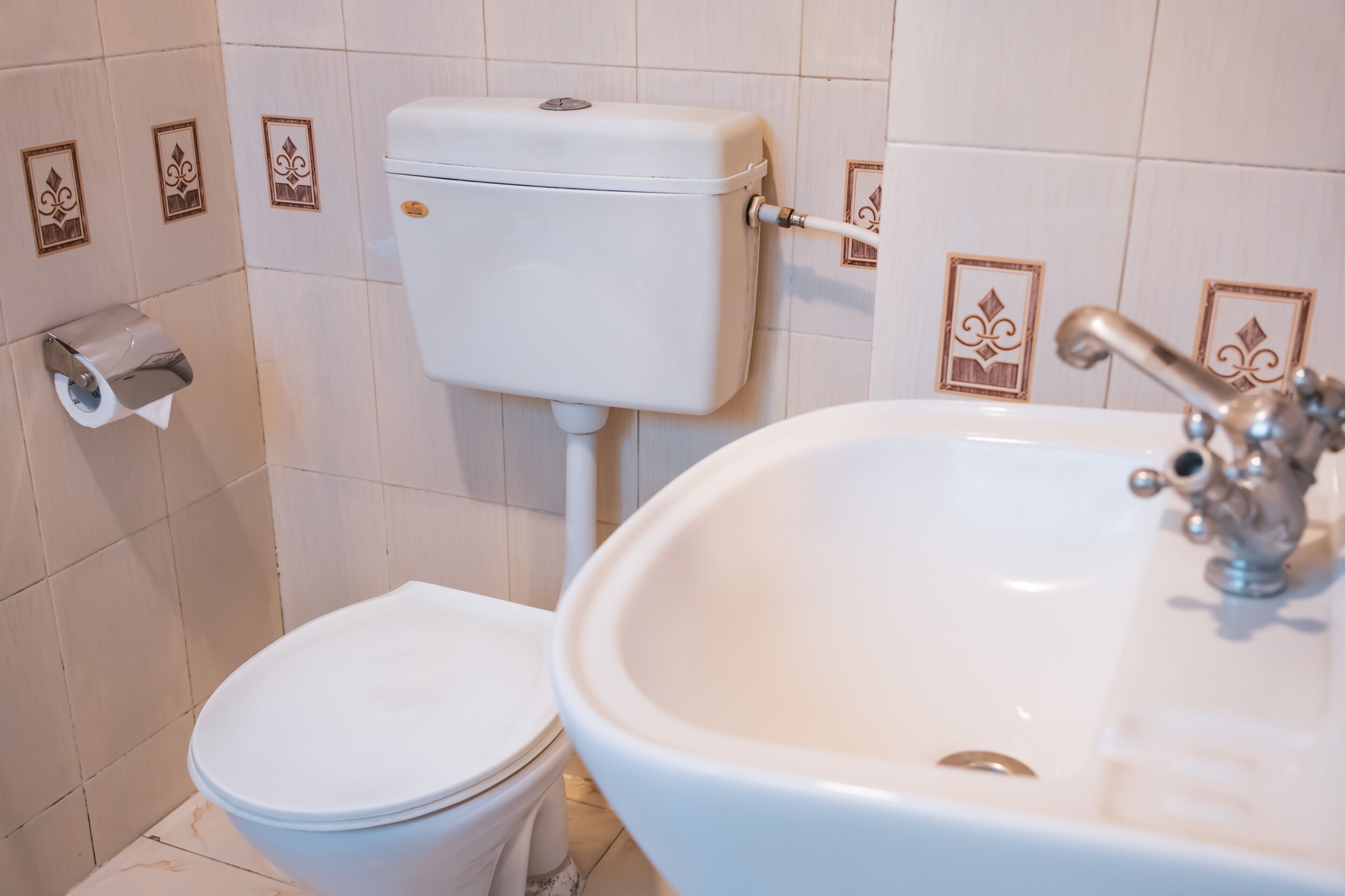 separate bathtub and shower, hair dryer, slippers, towels