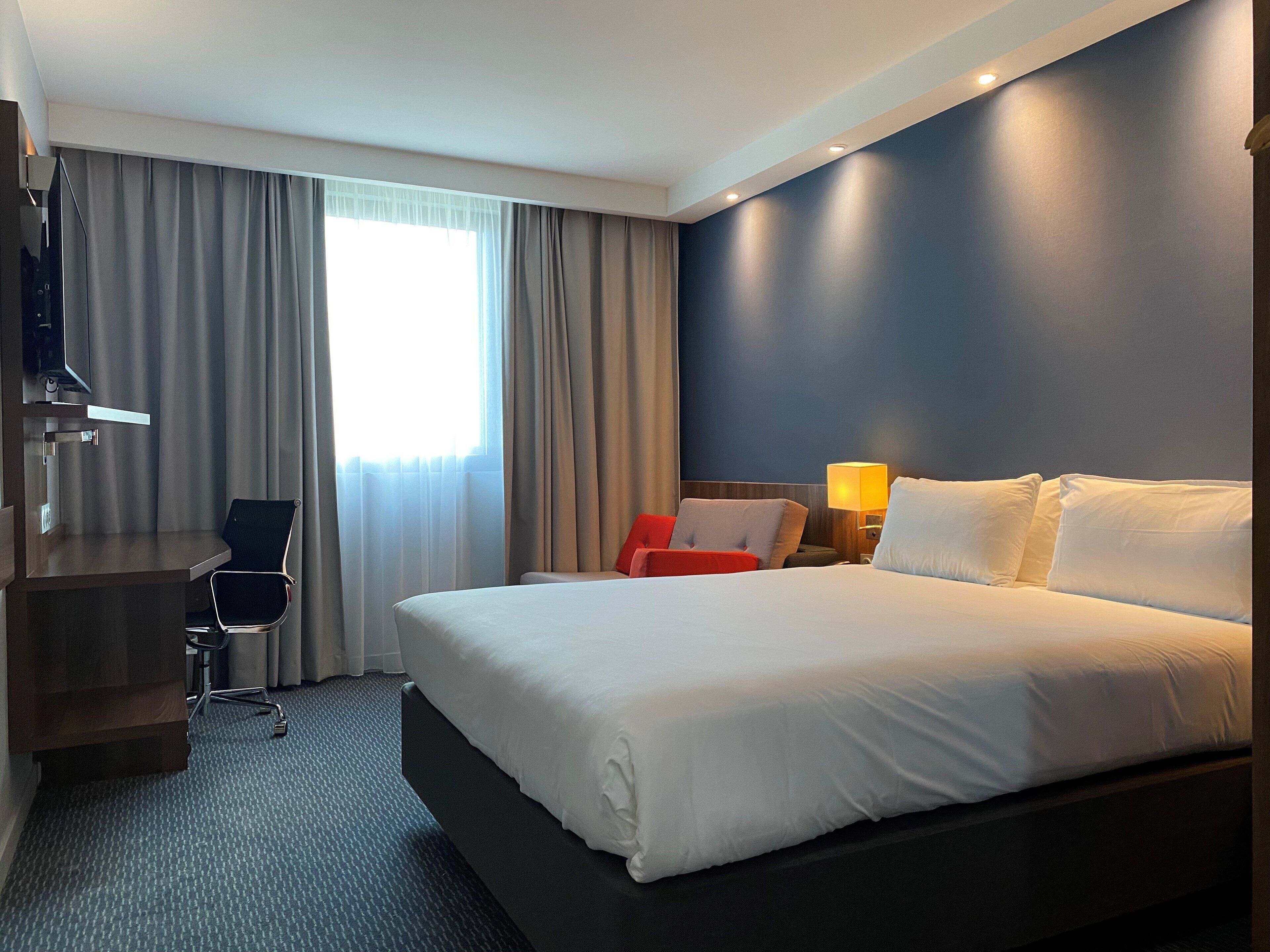 Premium bedding, individually furnished, desk, blackout drapes