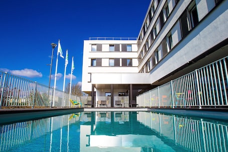 Seasonal outdoor pool, open 9:00 AM to 9:00 PM, sun loungers