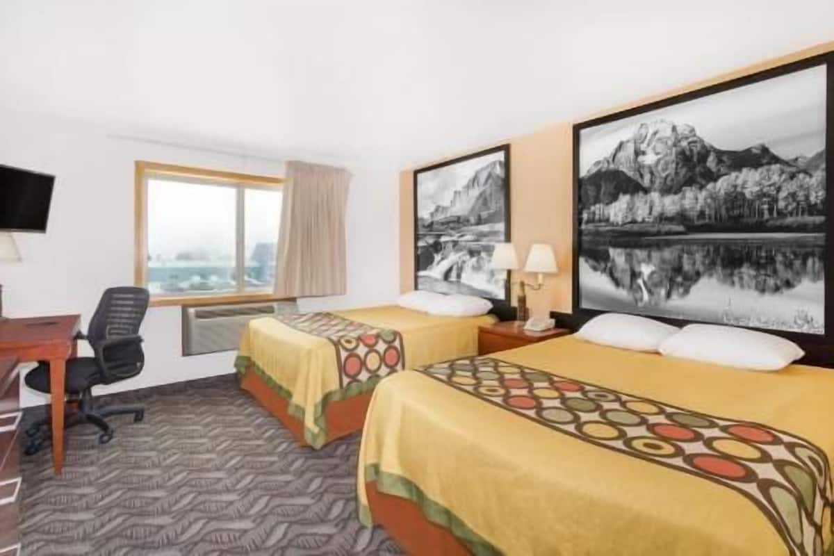 Desk, laptop workspace, blackout drapes, iron/ironing board