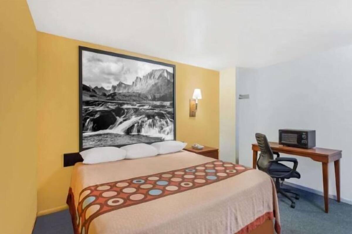 Desk, laptop workspace, blackout curtains, iron/ironing board