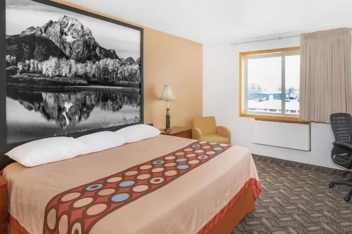 Desk, laptop workspace, blackout drapes, iron/ironing board