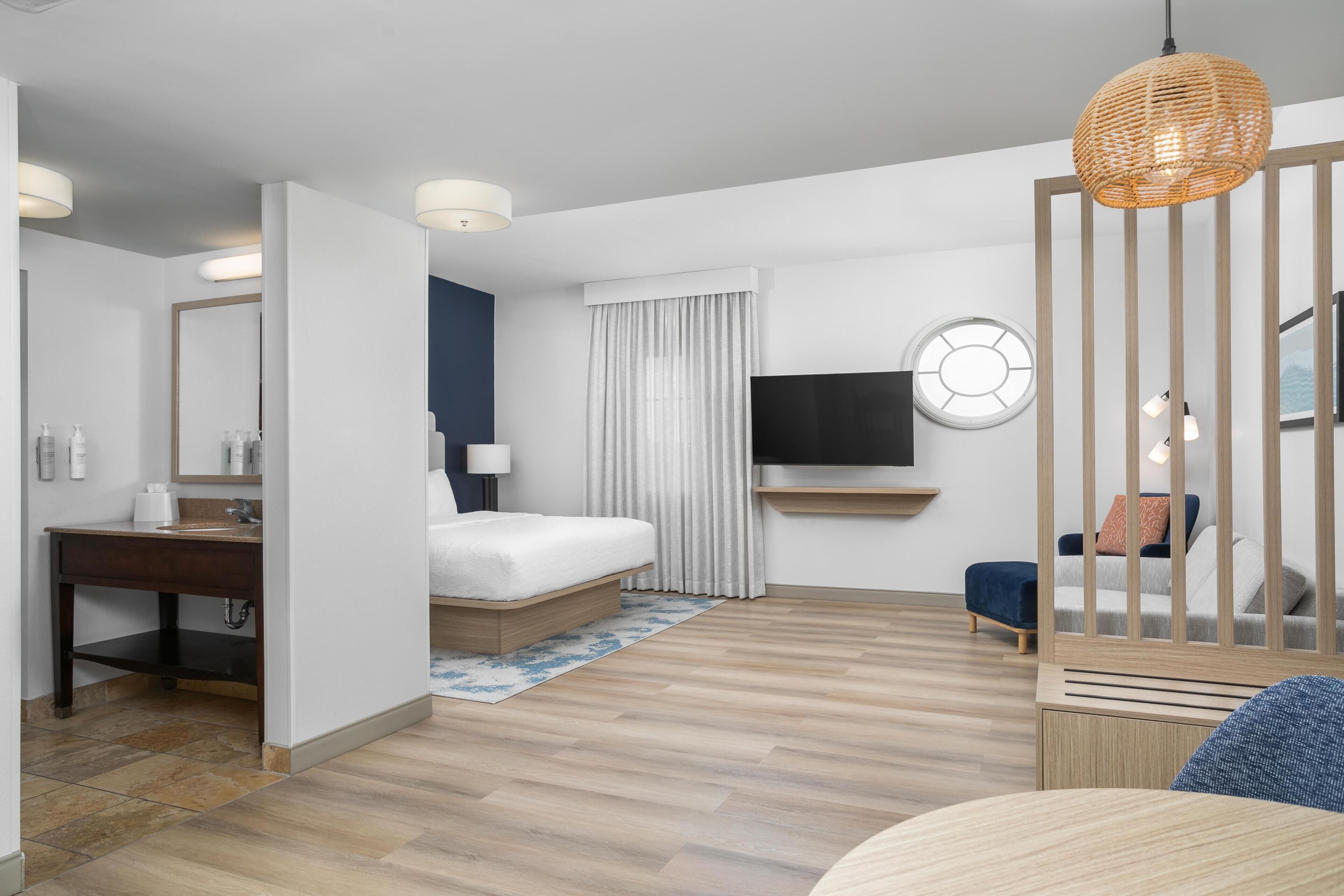 Hypo-allergenic bedding, desk, laptop workspace, blackout curtains