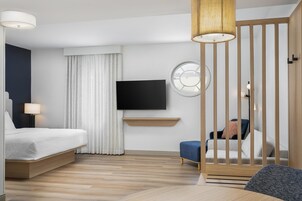 Hypo-allergenic bedding, desk, laptop workspace, blackout drapes