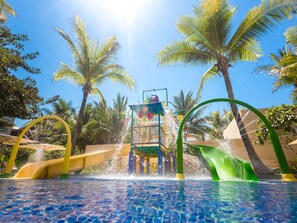 A water park with slides and a pool. - The Mulia Bali (Nusa Dua)