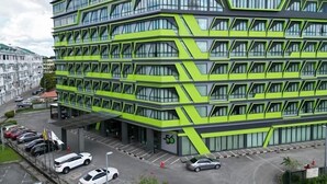 A multi-story building with a modern design, featuring a series of balconies and large windows. - 56 Hotel (Kuching)