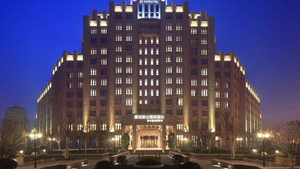 A large, multi-story hotel with a prominent sign at the top reading "Four Points by Sheraton." - Four Points By Sheraton Luohe (Luohe)