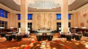 A spacious lobby with a central bar area, multiple seating arrangements, and large windows. - Four Points By Sheraton Luohe (Luohe)