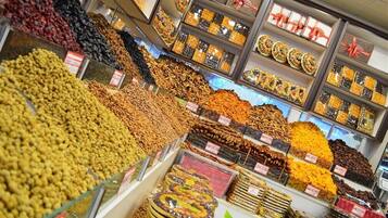 A variety of dried fruits and nuts displayed in a store.