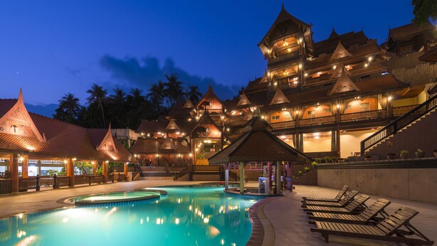 A hotel with a swimming pool, traditional architecture, and a well-lit outdoor area. - Grand Sea Beach Resort (Ko Pha-ngan)