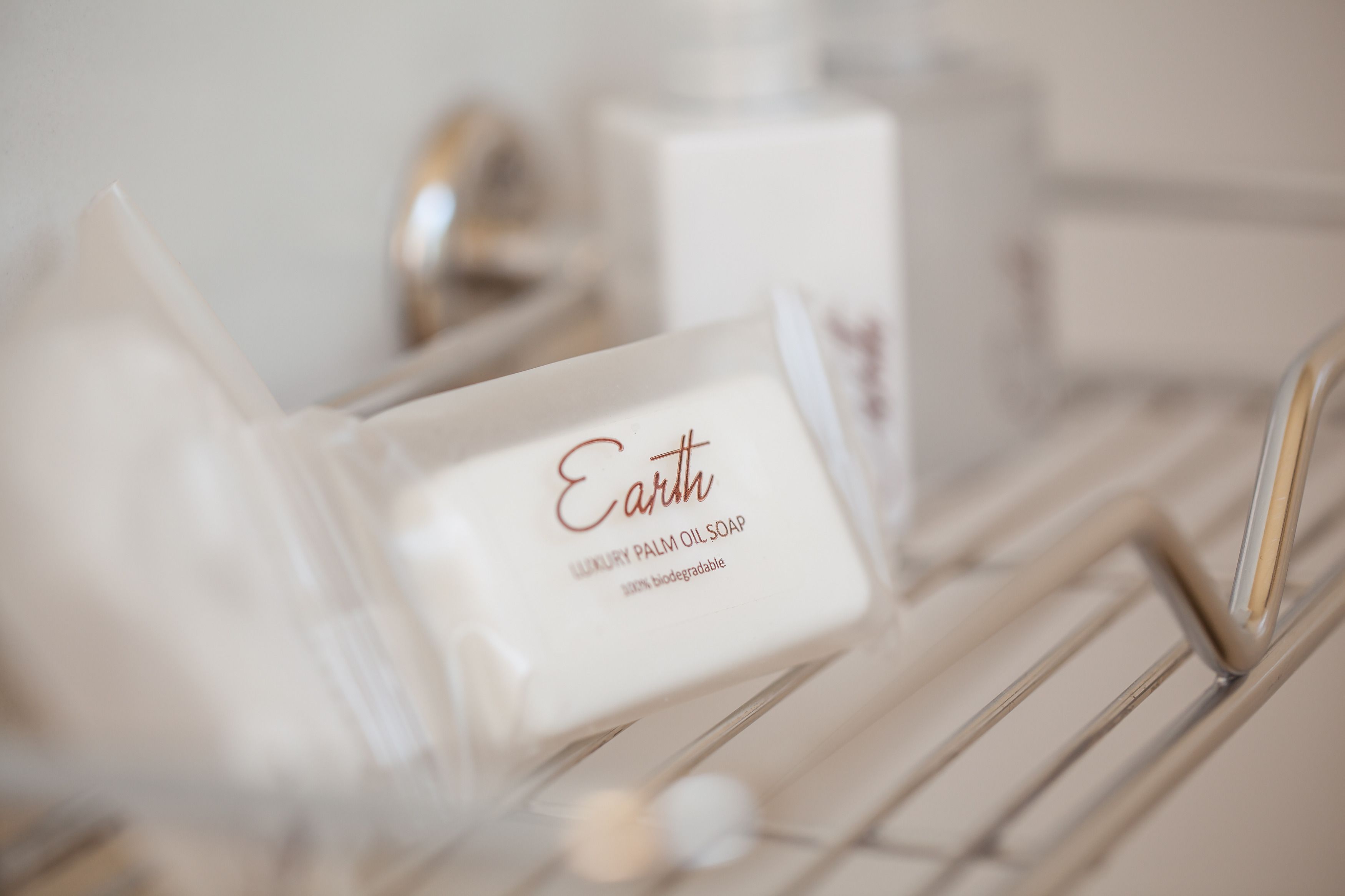 A luxury palm oil soap on a white shelf.