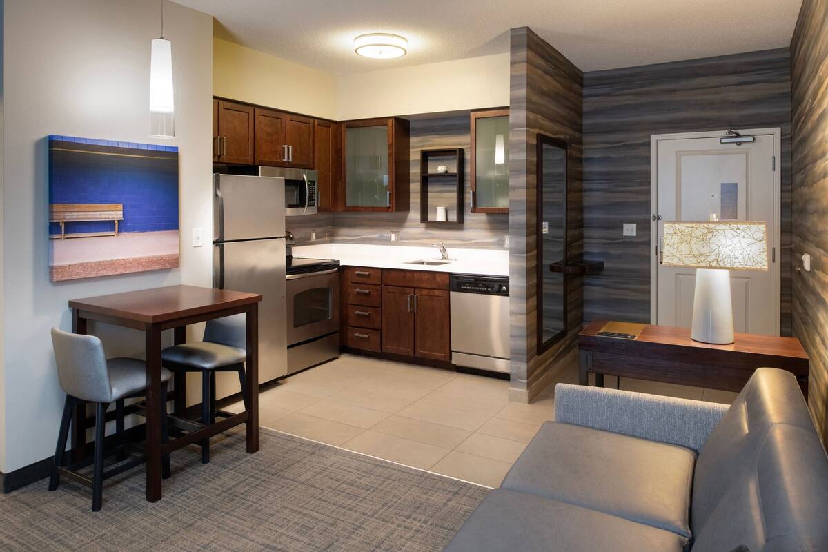 full-sized fridge, microwave, stovetop, dishwasher