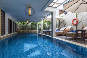 Indoor pool, pool umbrellas, sun loungers
