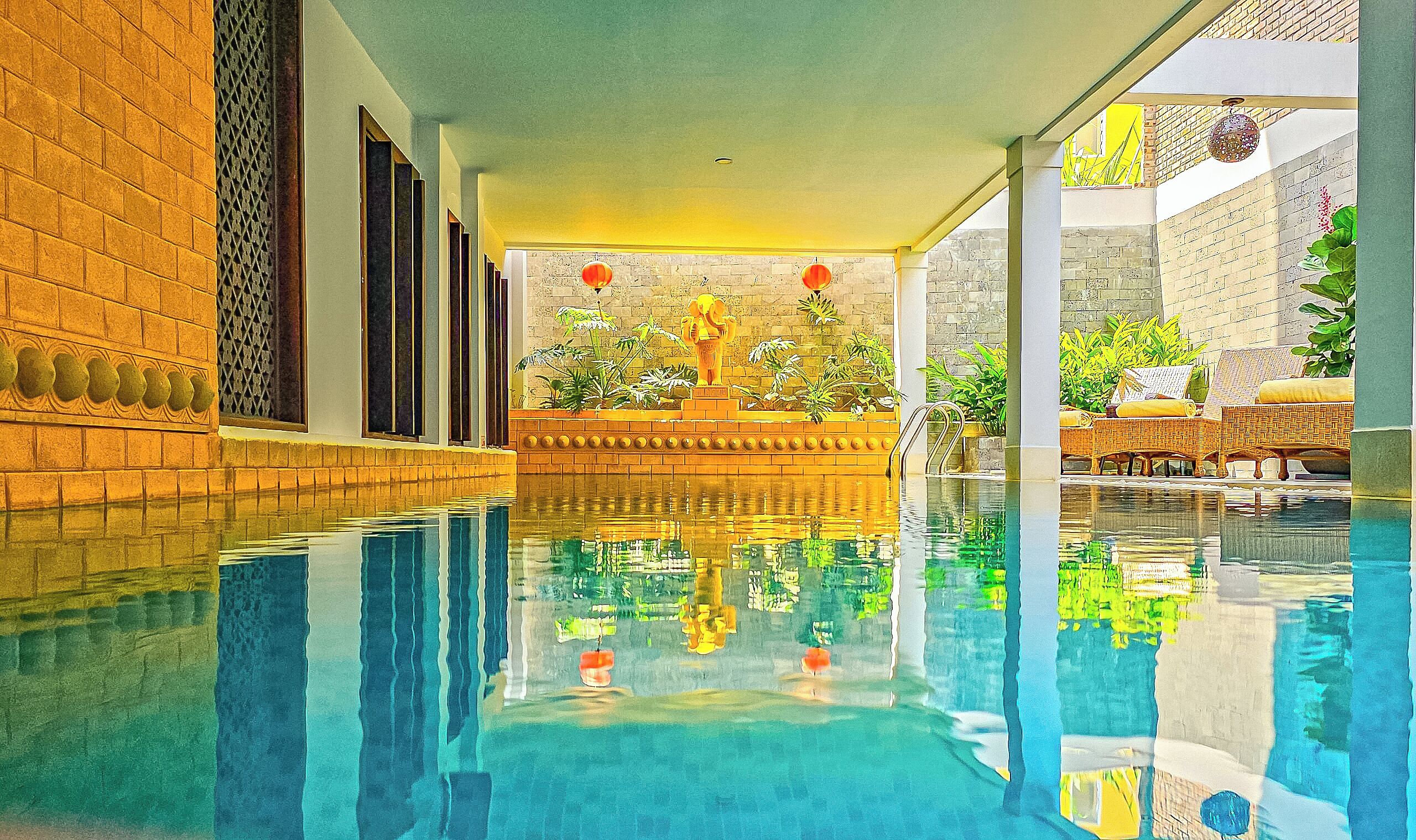 indoor pool, pool umbrellas, pool loungers
