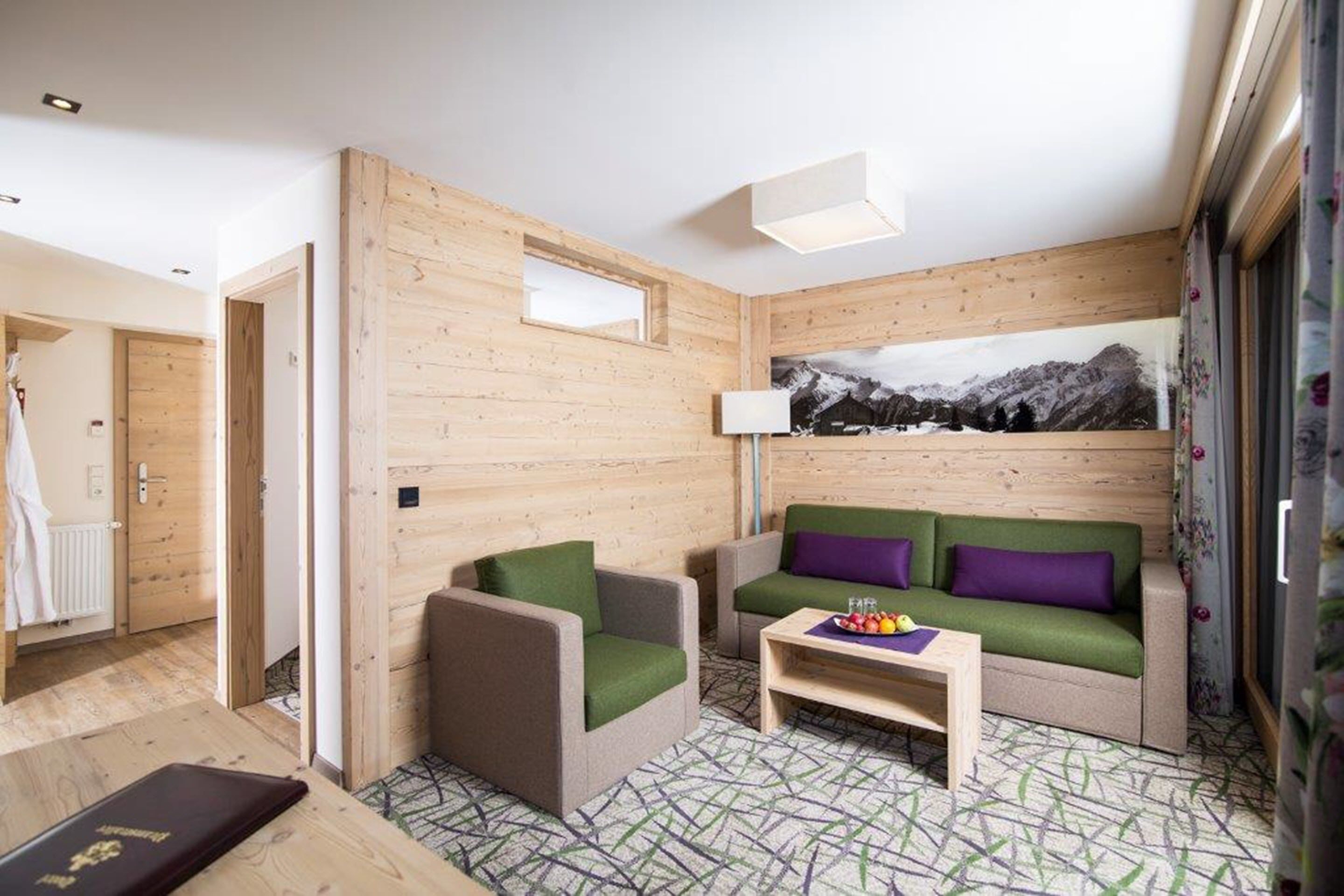 suite, 2 bedrooms, balcony, mountain view | living area | 45-inch led tv with cable channels, tv, table football