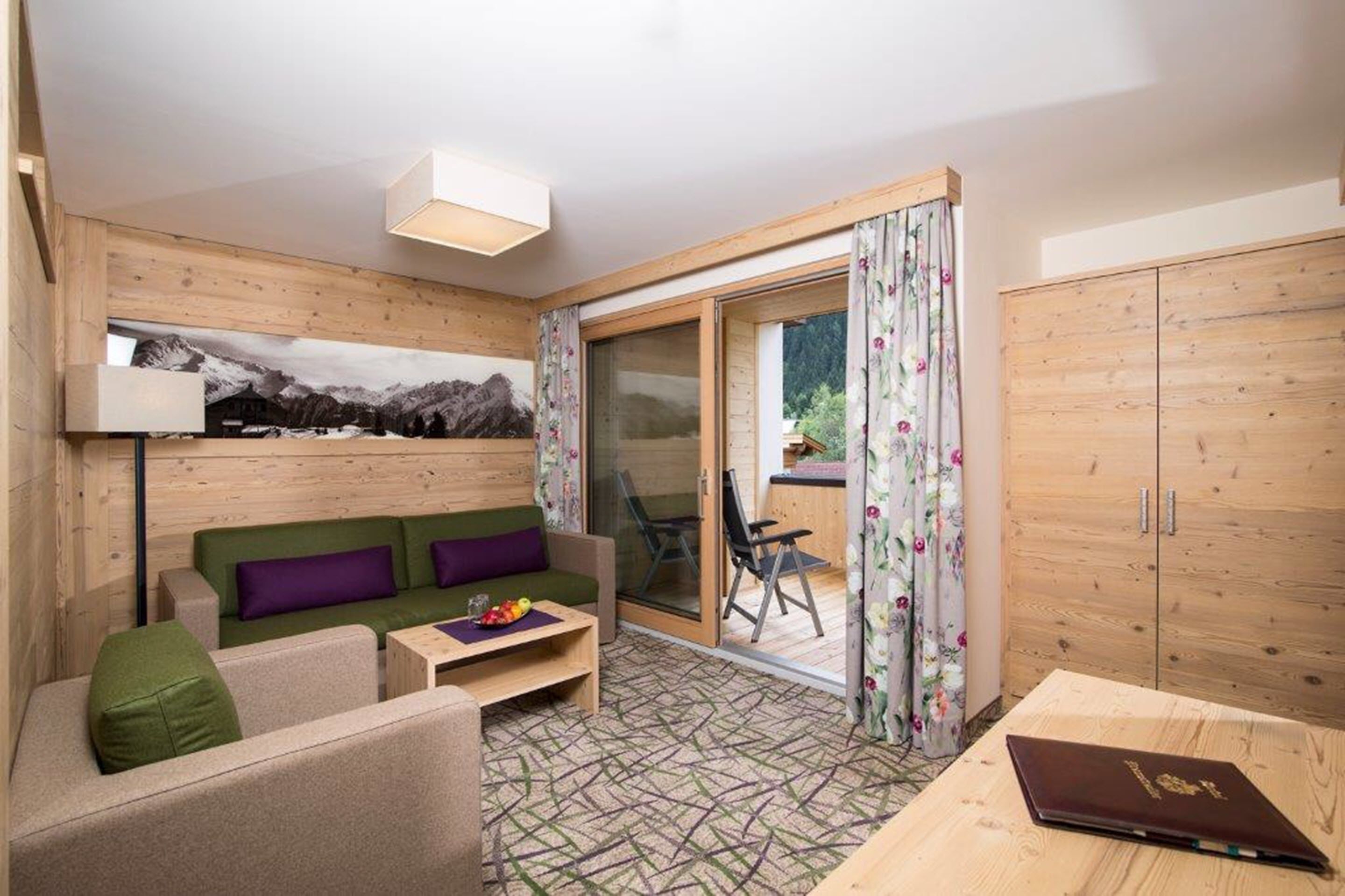 suite, 2 bedrooms, balcony, mountain view | living area | 45-inch led tv with cable channels, tv, table football