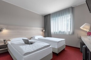 Premium bedding, desk, blackout curtains, soundproofing