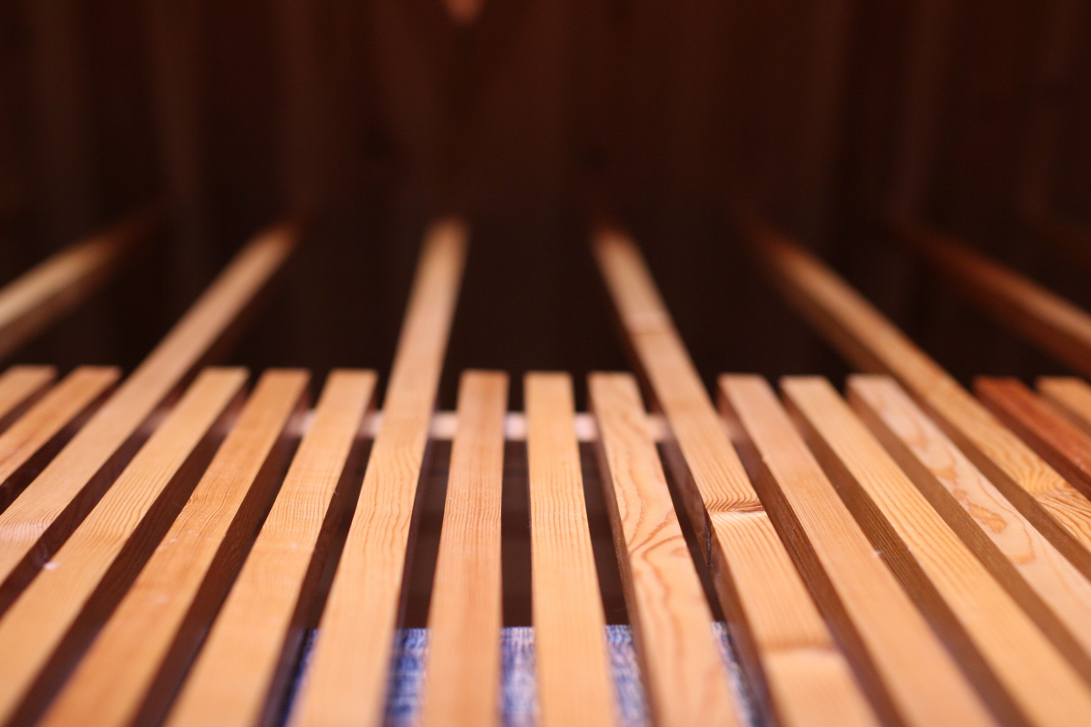 A close-up of wooden slats on a bench.