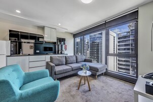 One Bedroom Apartment | Living area | 40-inch LCD TV with digital channels, TV