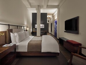 Italiaanse Frette-lakens, luxe beddengoed, donsdekens, een minibar