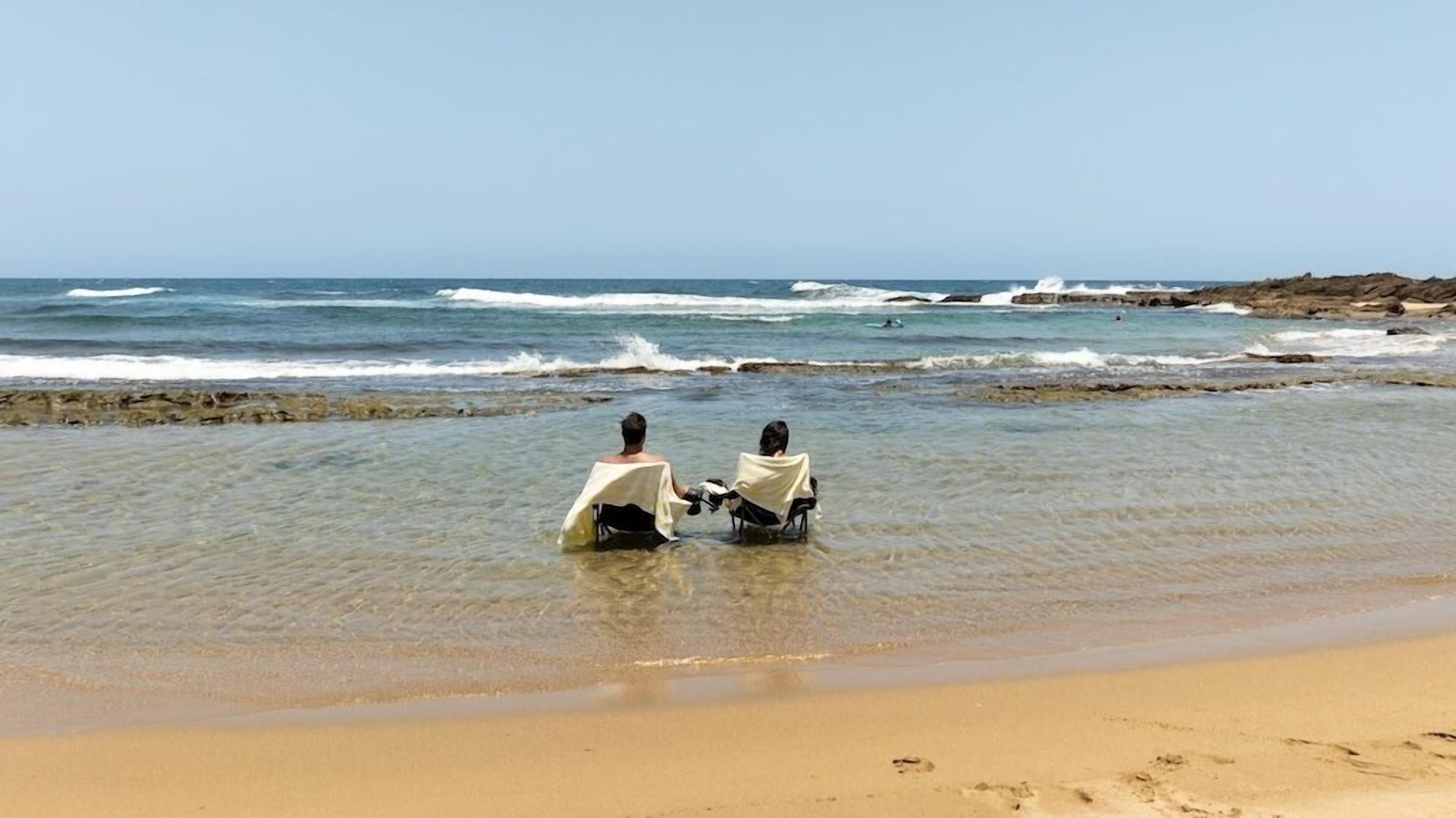 Sabbia bianca, ombrelloni, teli da spiaggia