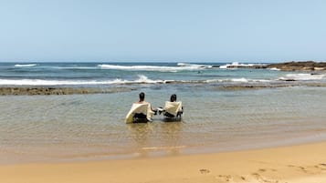 Sabbia bianca, ombrelloni, teli da spiaggia
