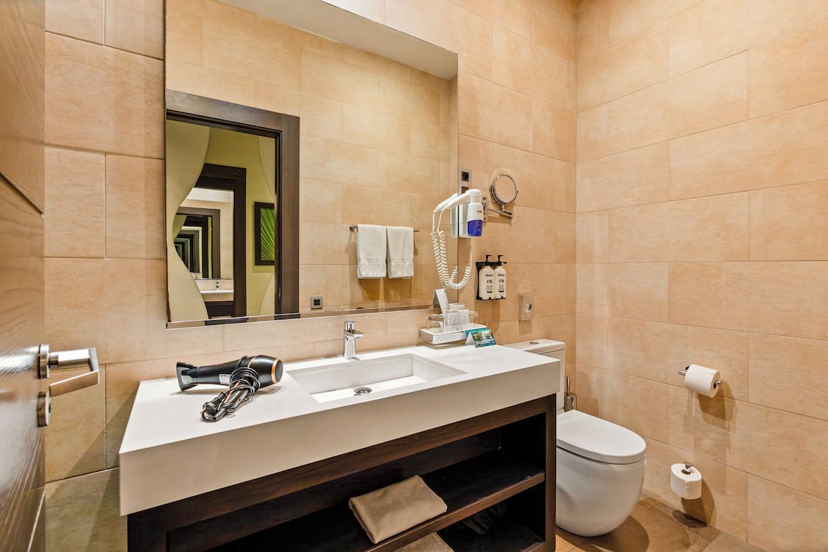 Designer toiletries, hair dryer, bathrobes, slippers