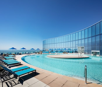 Indoor pool, seasonal outdoor pool, cabanas (surcharge), sun loungers at Ocean Casino Resort