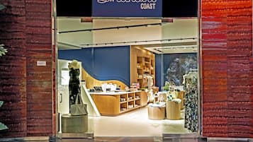 A Sweetheart Coast store with a modern interior, a wooden counter, and a variety of displayed items.