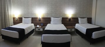Executive Triple Room | Minibar, in-room safe, individually decorated, individually furnished