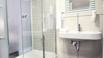 Shower, free toiletries, hair dryer, slippers