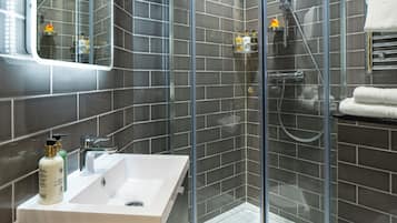 Combined shower/tub, hair dryer, towels, soap