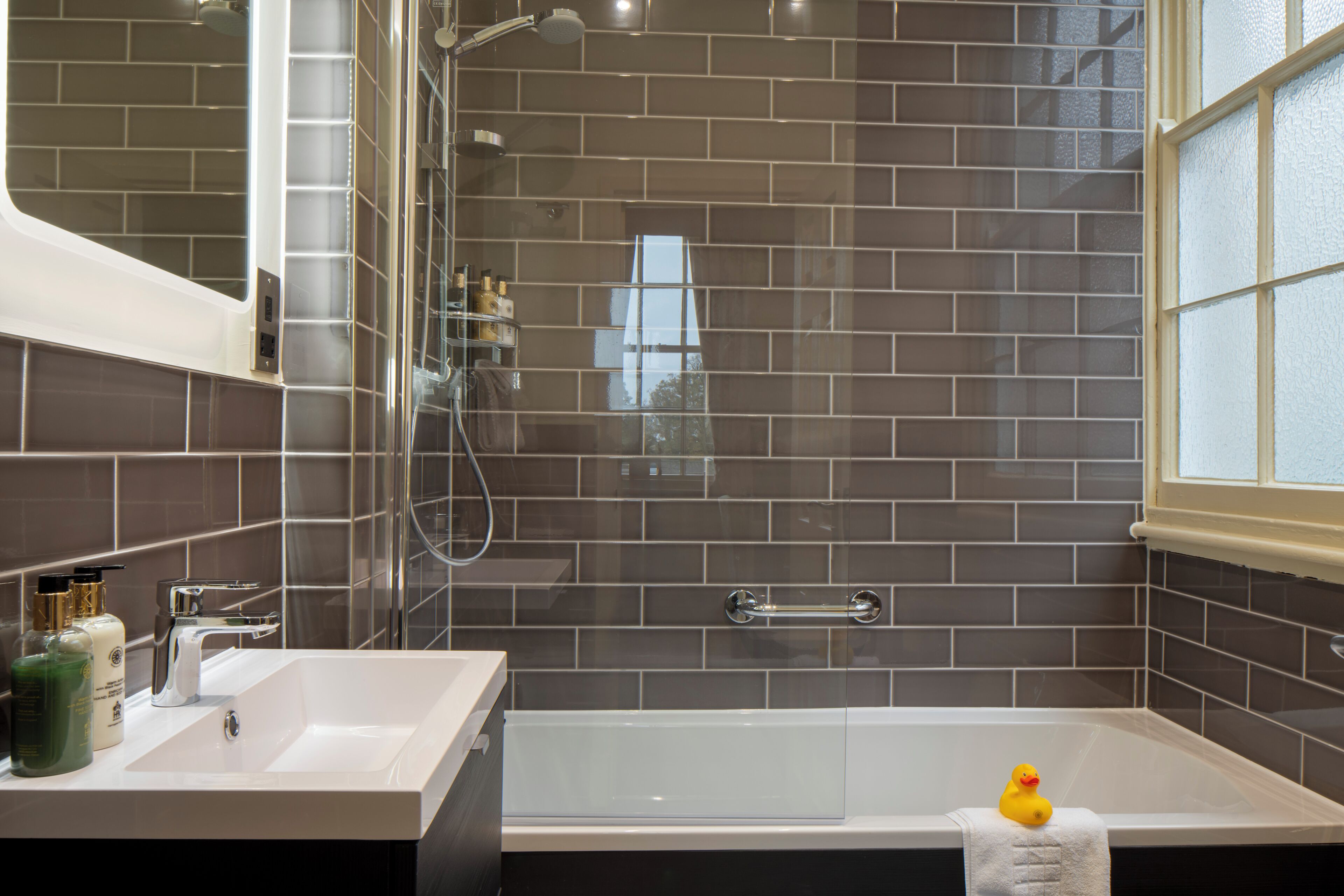 Combined shower/bathtub, hair dryer, towels, soap