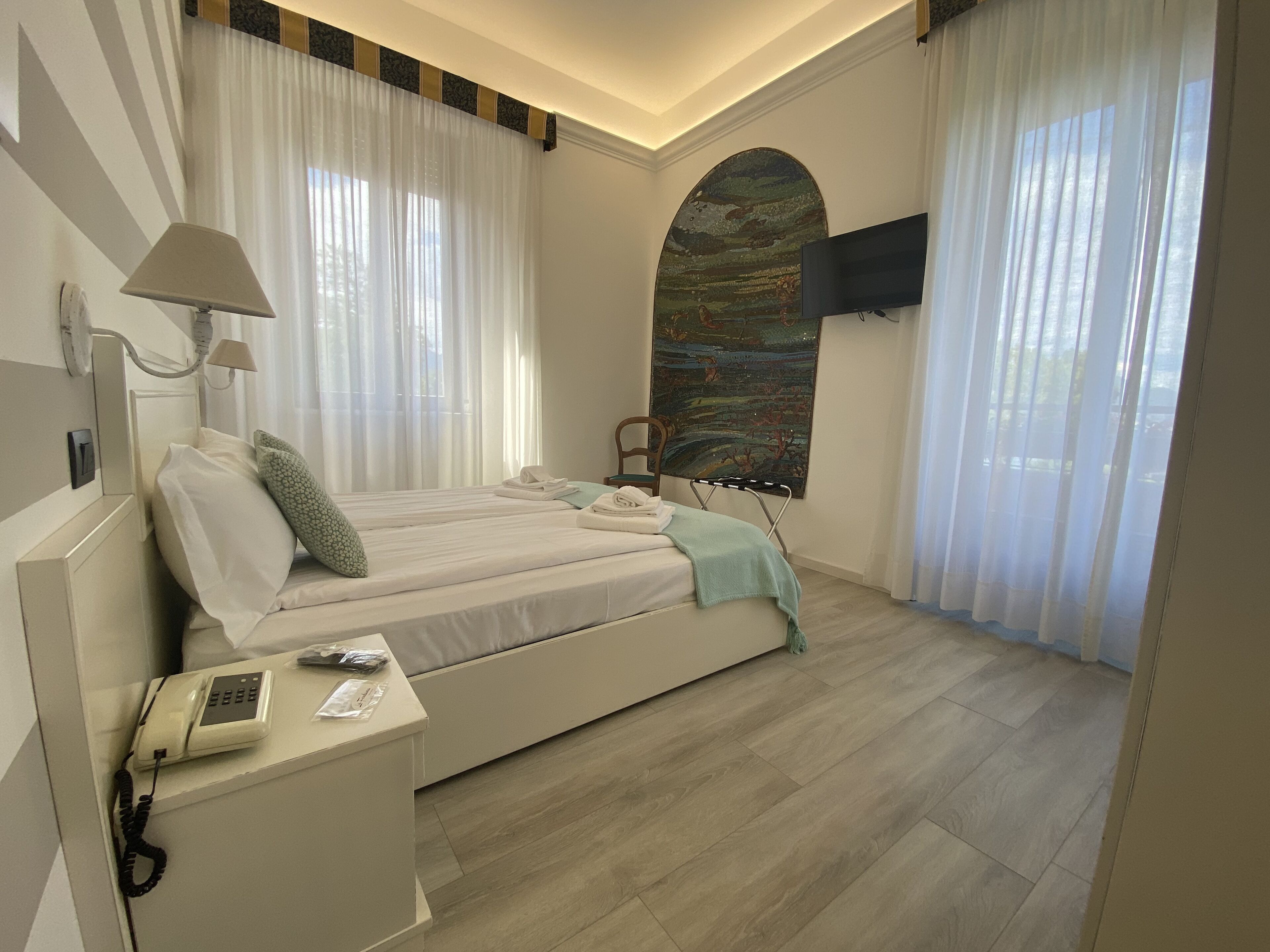 standard room, balcony, lake view | down duvets, memory-foam beds, minibar, in-room safe