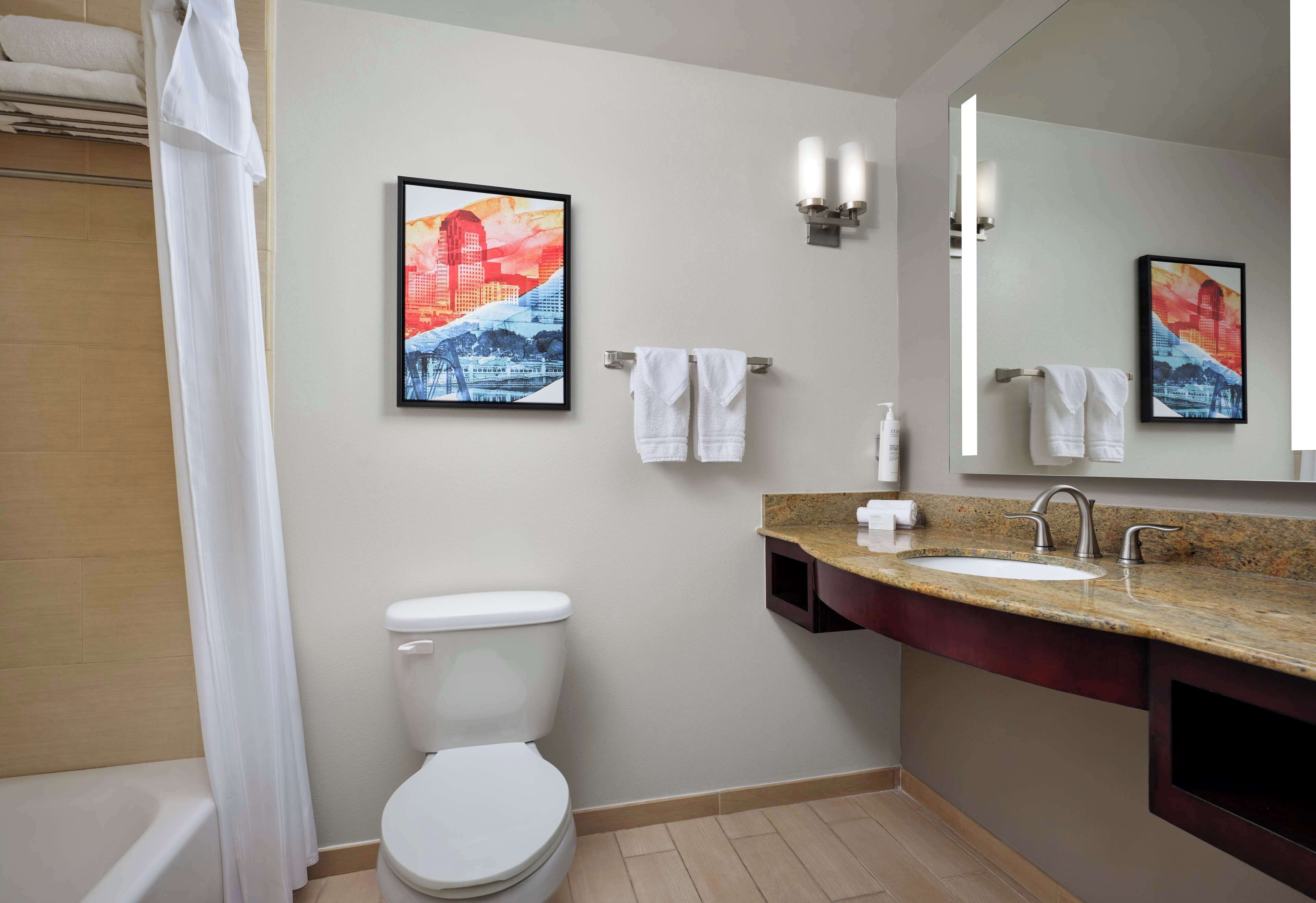 room | bathroom | designer toiletries, hair dryer, towels, soap