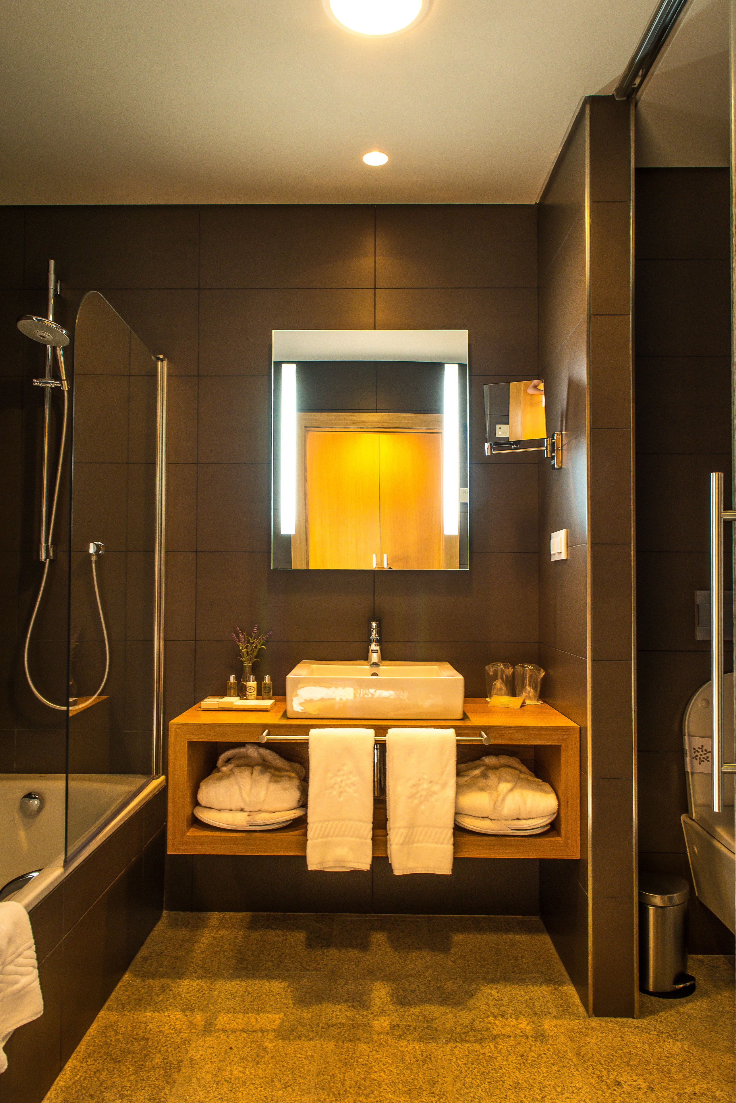 rainfall showerhead, hair dryer, bathrobes, slippers