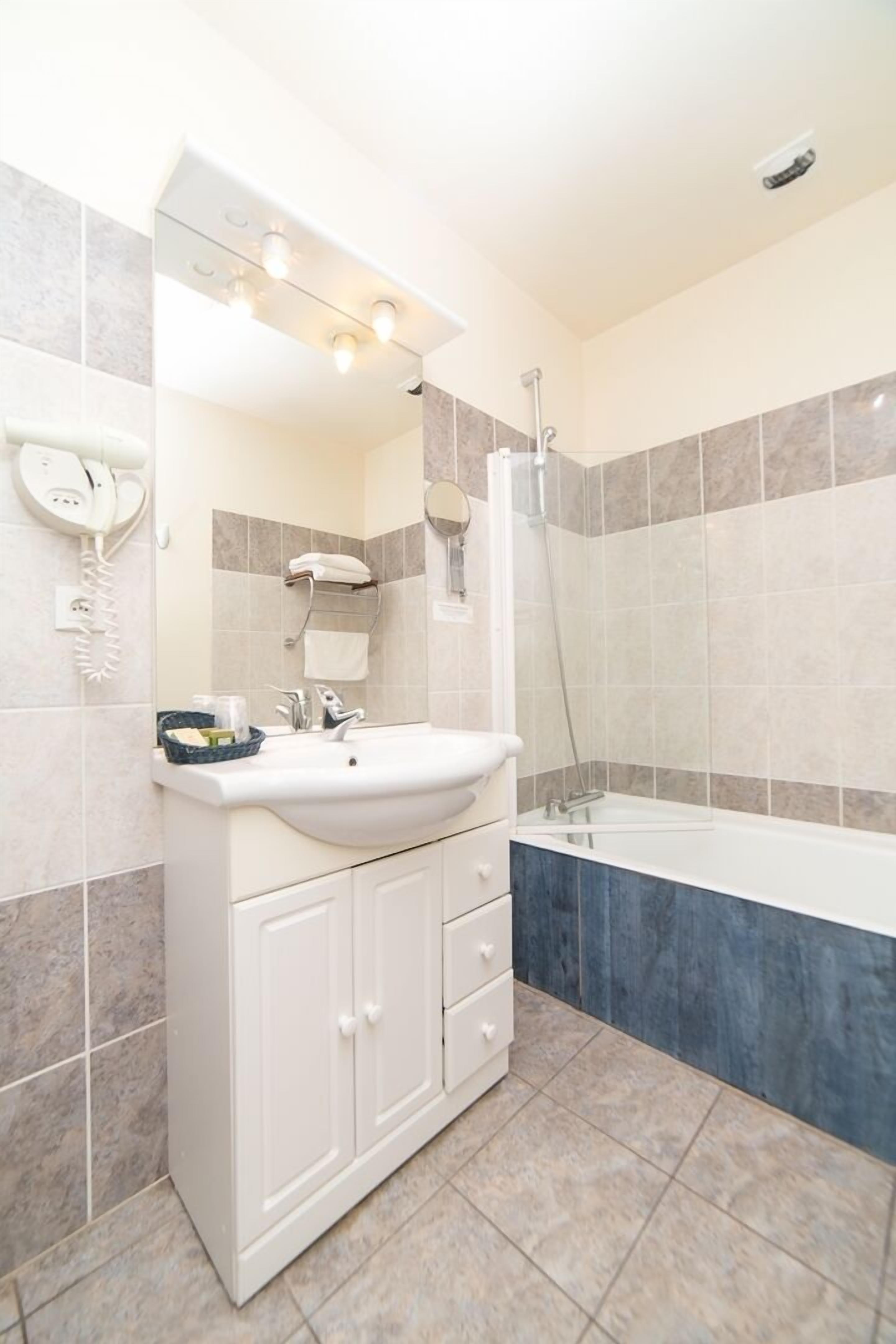 superior double room | bathroom | hair dryer, towels