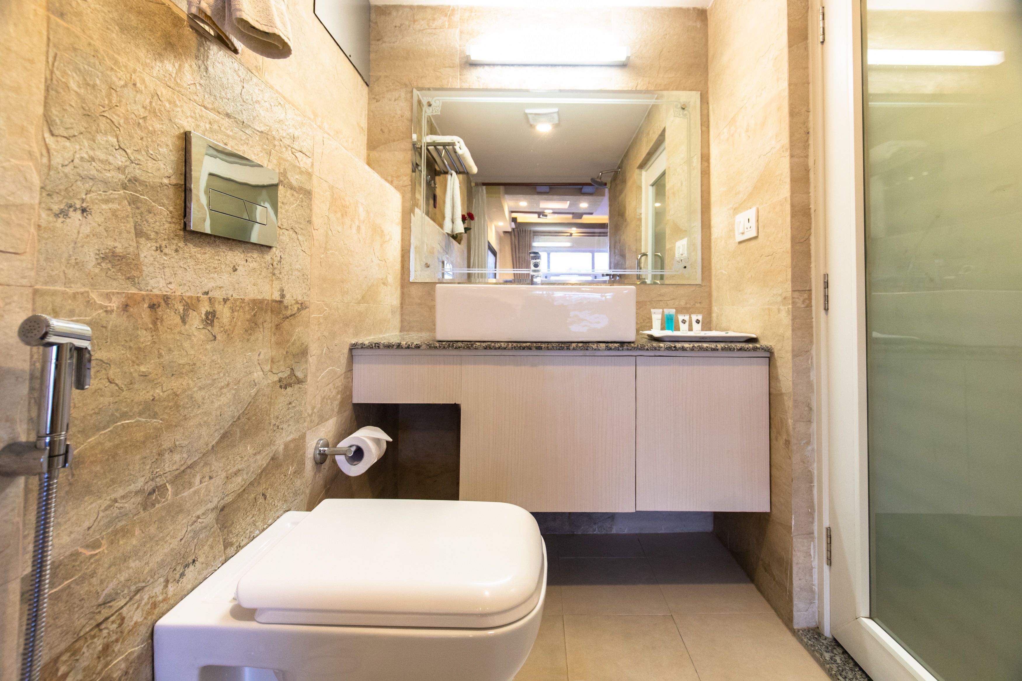 deluxe single room, 1 single bed, private bathroom, city view | bathroom | rainfall showerhead, free toiletries, hair dryer, slippers