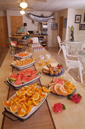 Enjoy a delicious breakfast spread with fresh fruits and breakfast items in a casual dining area.